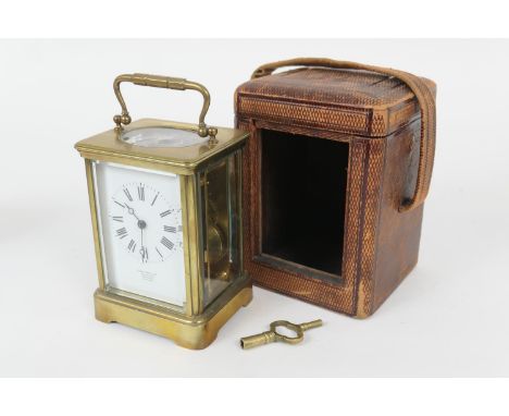 French brass carriage clock by E M & Co., Paris, white enamelled dial with Roman numerals, inscribed 'John Hall & Co., Manche