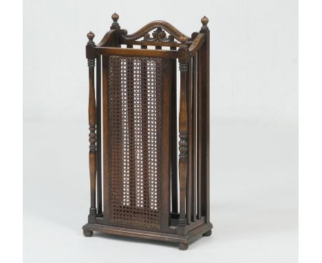 George V oak stick stand, with bergere panel front, original drip tray, height 79cm, width 38cm (Please note condition is not