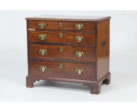 George III mahogany small chest of drawers, the top crossbanded with walnut, over four long graduating drawers with later bra