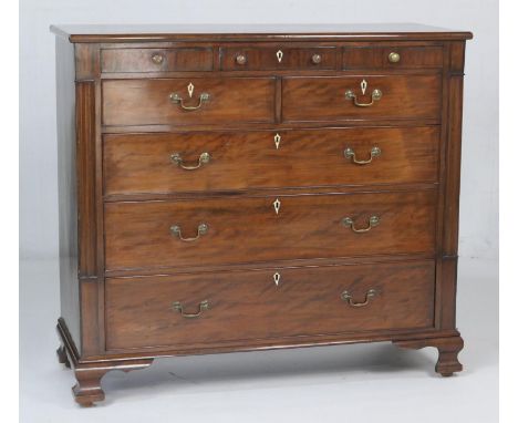 Late George III mahogany chest of drawers, circa 1810-20, fitted with three small frieze drawers with brass knobs, over two s