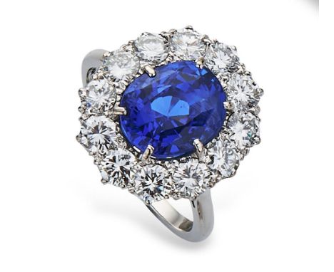 Fine sapphire and diamond cluster ring by Boodles, the mixed cushion cut natural sapphire measuring 11.27mm x 9.25mm x 8.93mm