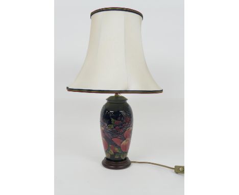 Moorcroft Finches and Berries ovoid table lamp, complete with original wooden base and cream coloured shade, total height 63c