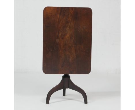 Mahogany tilt top tripod table, the rectangular top over a turned baluster column and three umbrella supports, width 84cm, de