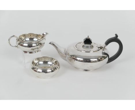 George V silver three piece tea service, by Richard Woodman Burbridge for Harrods Ltd, London 1928, comprising teapot of bun 