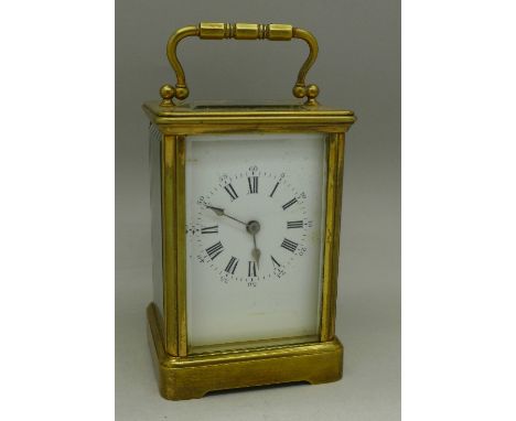 A brass and glass carriage clock, height 11cm