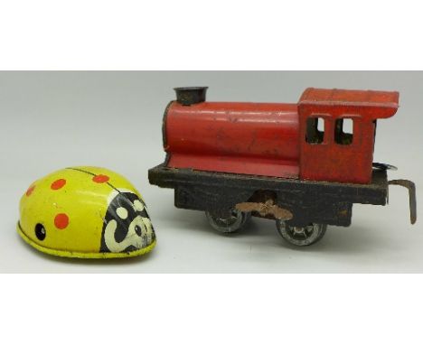 A clockwork Chad Valley ladybird and a clockwork train