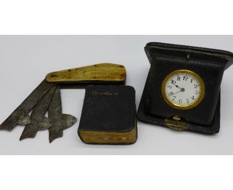 A horn handled three blade fleam, W Webster, Sycamore works, miniature hymn book and cased travel clock