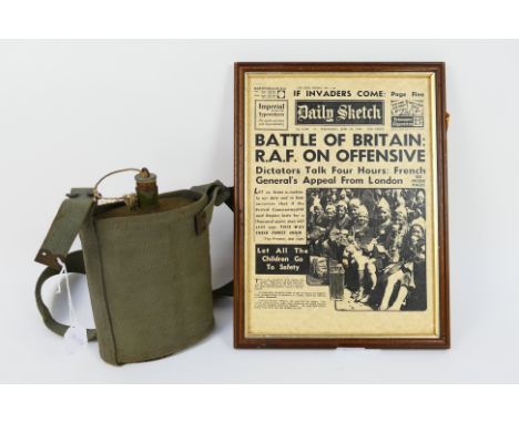 A British Army water bottle with canvas holster and framed facsimile World War Two period newspaper cover. [2]. [W]
