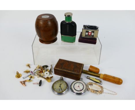 A mixed lot of collectables to include pocket watch, cigarette lighter, hip flask, cufflinks, decanter label and other. [W]