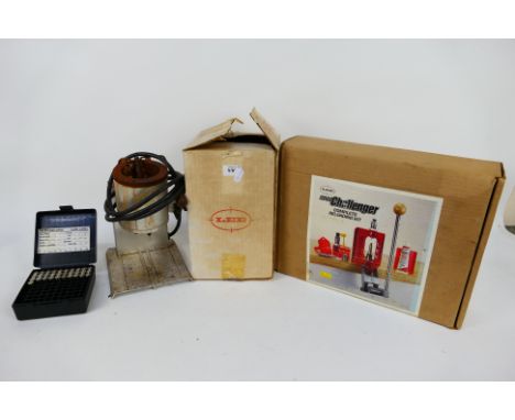 Vintage re-loading equipment comprising a Lee 2001 Challenger and a Lee Production Pot IV, both boxed. [2]
