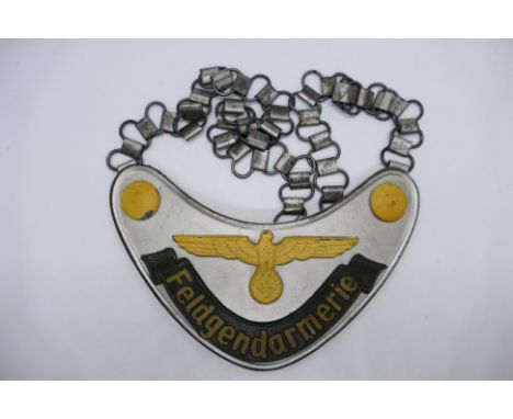 A World War Two (WW2 / WWII) style German Feldgendarmerie Gorget with neck chain.