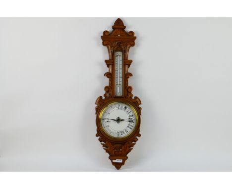 An oak cased banjo barometer / thermometer, 88 cm (h). [W]