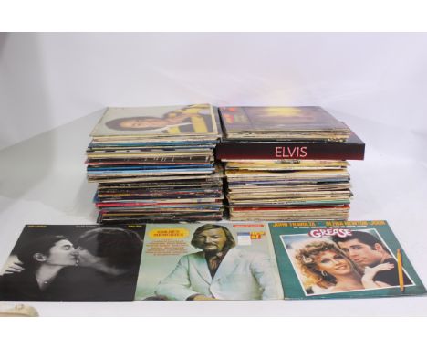 A collection of predominantly 12" vinyl records to include The Beatles, The Who, Cat Stevens, The Rolling Stones and other, t