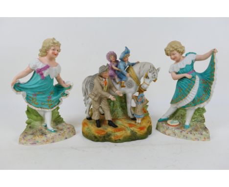 A pair of European ceramic figures depicting young girls, each approximately 30 cm (h) and a similar group with children on h