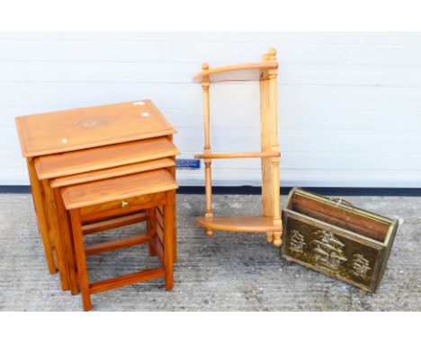 A nest of four tables, approximately 54 cm x 54 cm x 33 cm when nesting, an Ercol wall mountable corner shelving unit, approx