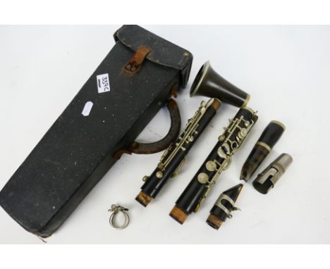 Cabart - Clarinet - Boosey & Co - J Heyworth & Son. A French 'Cabart a Paris' ebony clarinet housed in a leather bound, lined