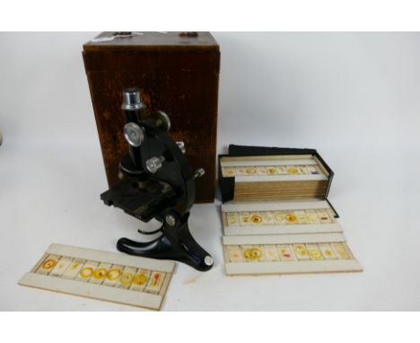 A Beck London microscope, model 29, contained in fitted case with a box of slides of biological samples. [2]