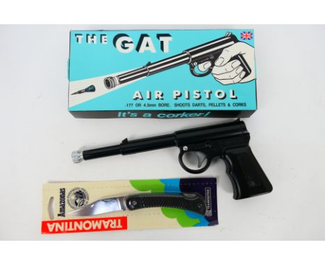 A boxed T J Harrington & Sons .177 air pistol, The Gat and an Amazonas lock knife.Note: This lot is not for sale to people un