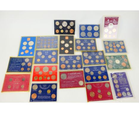 Various vintage ERII Coinage Of Great Britain sets, commemorative coin sets and similar.