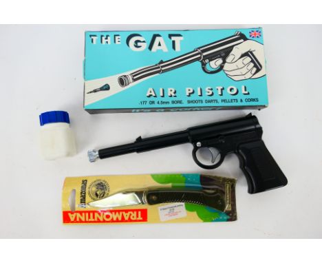 A boxed T J Harrington & Sons .177 air pistol, The Gat and an Amazonas lock knife.Note: This lot is not for sale to people un