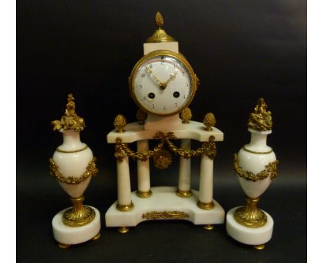 A 19th Century French White Marble Ormolu Mounted Three Piece Clock Garniture, the clock of Portico form, the enamel dial wit