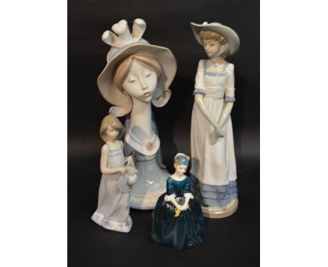 A Lladro Porcelain Bust in the form of a Girl Wearing A Hat upon circular pedestal base together with another Lladro small fi