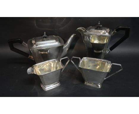 A Silver Four Piece Tea Service comprising teapot, cream jug, sugar bowl and hot water pot with ebonised handles, the teapot 