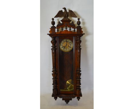 A 19th Century Mahogany Large Vienna Wall Clock, the pierced eagle surmount above a glazed door flanked by half turned pilast