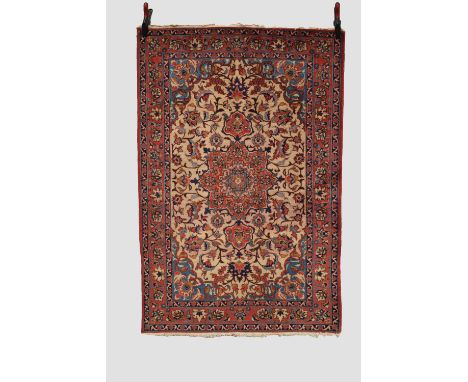 Esfahan rug, central Persia, circa 1940s-50s, 5ft. 2in. X 3ft. 6in. 1.58m. x 1.07m. Very slight loss to ends. Cream field wit