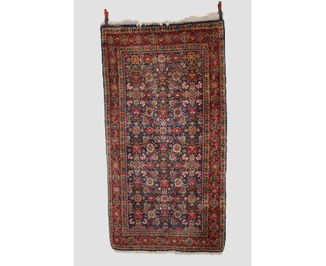 Mahal rug, north west Persia, circa 1940s-50s, 7ft. 6in. X 3ft. 11in. 2.29m. X 1.20m. Dark blue field with all over herati de