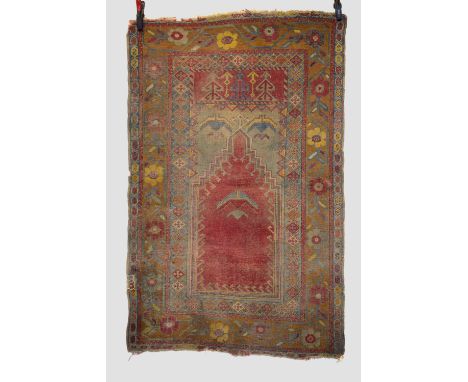 Konya prayer rug, central Anatolia, early 20th century, 5ft. 4in. X 3ft. 5in. 1.63m. X 1.04m. Overall wear with corrosion to 
