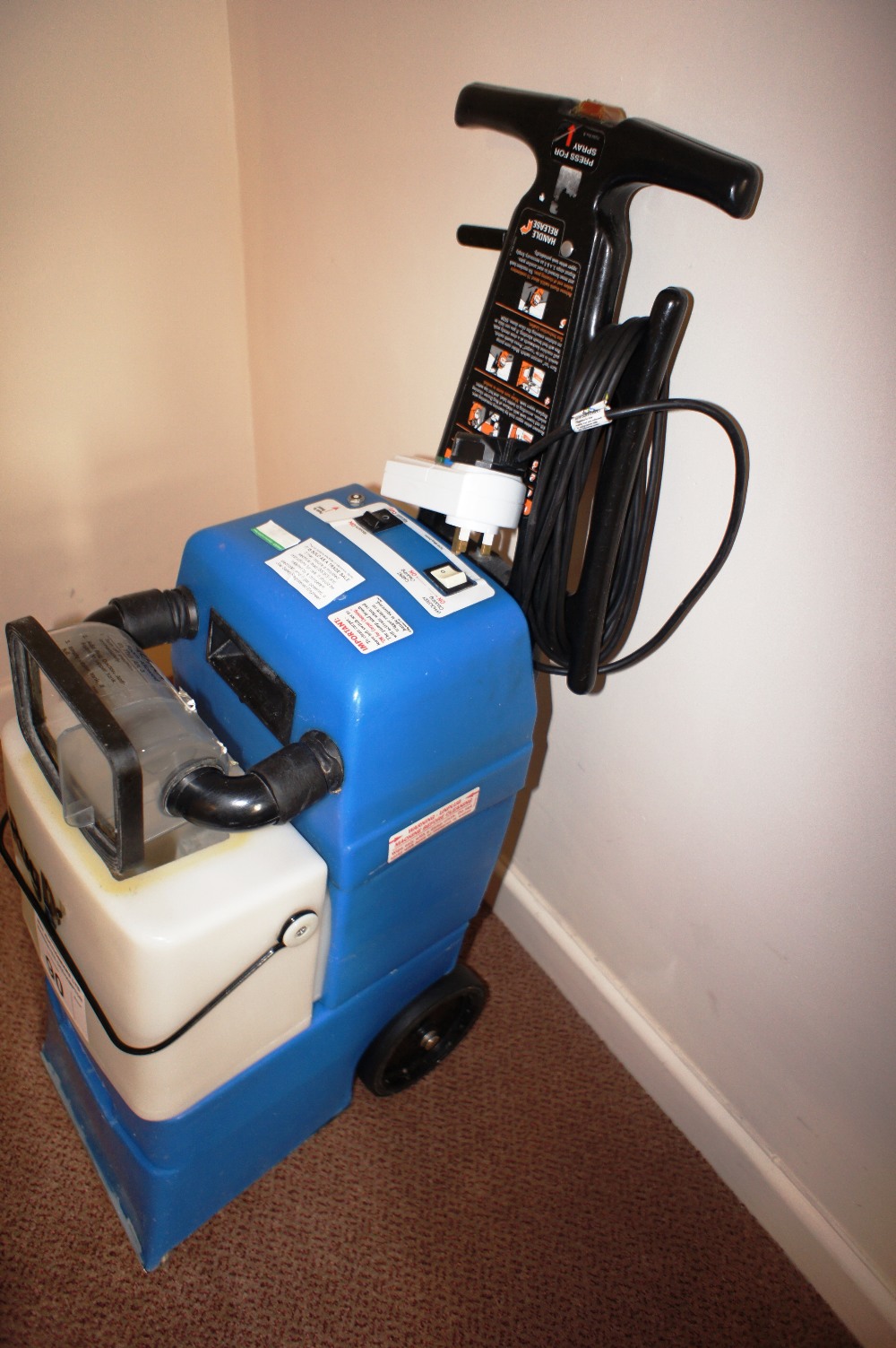 a Rug Doctor EZ1 MPC2 carpet cleaning machine (located in hallway)