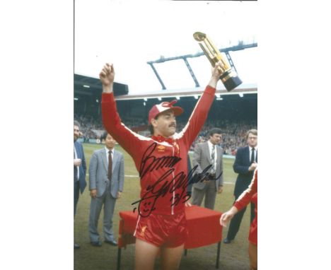 BRUCE GROBBELAAR football autographed 12 x 8 photo, a superb image depicting the Liverpool goalkeeper holding the First Divis