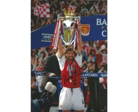 Tony Adams Arsenal football signed stunning 12 x 8 inch colour photo holding the Premiership trophy above his head. All autog