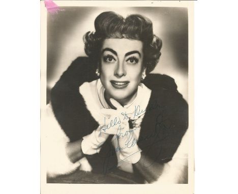 Joan Crawford signed 10x8 vintage photo. Small amount of paper stuck to top left hand corner and rip to bottom right hand cor