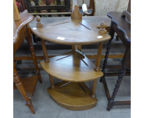 An Ercol Golden Dawn elm corner whatnot 