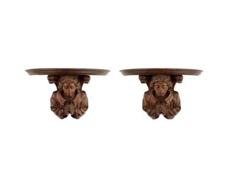 MANNER OF SIR ROBERT LORIMER  PAIR OF ARTS AND CRAFTS CARVED OAK WALL BRACKETS, EARLY 20TH CENTURY   each with shaped self an