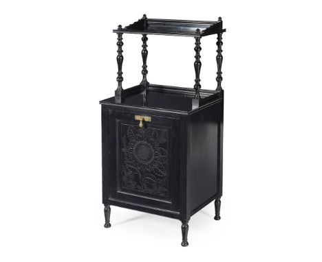 BENHAM & FROUD, LONDON  AESTHETIC MOVEMENT EBONISED PURDONIUM, CIRCA 1880   with hinged panel door enclosing a lined containe