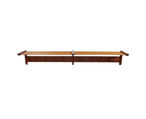 DANISH SCHOOL  WALNUT AND BEECH WALL MOUNTED HAT AND COAT RACK, CIRCA 1960   with eight conical shaped hooks, and a slatted s