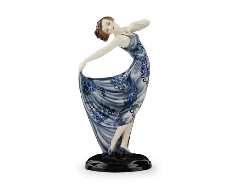 GOLDSCHEIDER, AUSTRIA  ART DECO CERAMIC FIGURE OF A DANCER, CIRCA 1930  modelled as a lady in a flowing blue dress, impressed