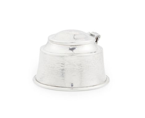 [§] ALBERT EDWARD JONES (1878-1954)  HAMMERED SILVER INKWELL, 1928   with a domed hinged lid and cylindrical base, liner lack