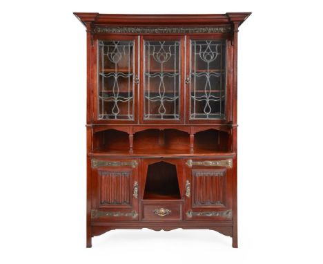 SHAPLAND & PETTER, BARNSTAPLE  ARTS & CRAFTS MAHOGANY BOOKCASE CABINET, CIRCA 1910   the projecting cornice with embossed cop