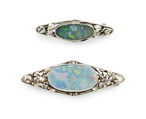 ATTRIBUTED TO RHODA WAGER  TWO OPAL DOUBLET AND WHITE METAL BROOCHES, CIRCA 1920   each with collet set opals, the tapering s