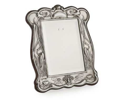 WILLIAM AITKEN, BIRMINGHAM  ART NOUVEAU SILVER MIRROR, DATED 1905   of shaped rectangular form, with herons, lotus flowers an