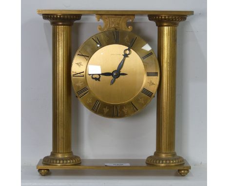 A contemporary Hour Lavigne gilt metal cased mantel Clock, W 23.5 cm x H 25 cm x D 7 cm.