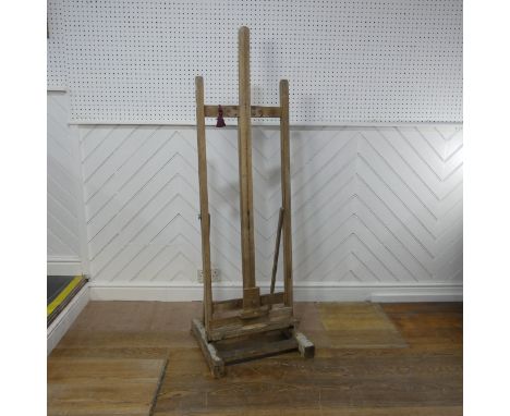 A vintage floor standing artists Easel, with an adjustable canvas support, W 52 cm x H 160 cm x D 48 cm.