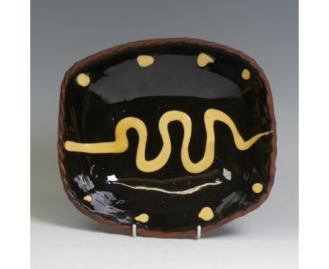 A Ray Finch Winchcombe pottery slipware Dish, with crimped edge, impressed mark to base, W 23cm x L 25cm.