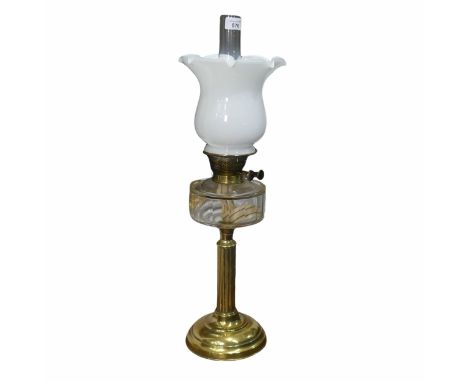 An antique brass Oil Lamp, with opaque shade and funnel, H 66 cm.