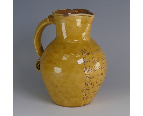 Edwin Beer Fishley (1832-1912) a Fremington pottery mottoware Jug,&nbsp;in typical yellow glaze with incised passage reading 
