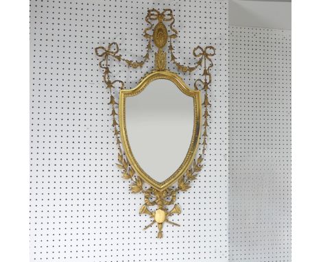 A giltwood framed wall Mirror in George III style, the frame decorated with foliate swags and bows, W 55 cm x H 105 cm, toget